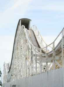 A close-up of a modern bridge with steel cables and a curved pedestrian walkway, architectural lines converging toward the sky.